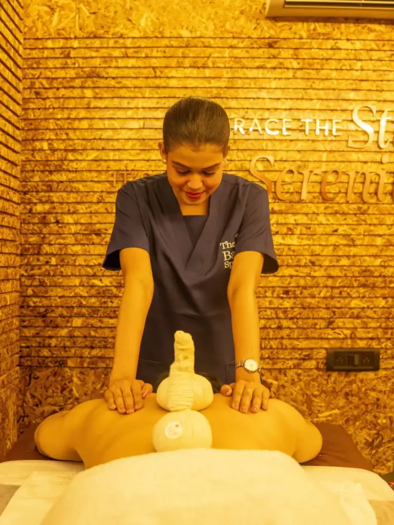 Aromatherapy massage at The Bali Spa & Wellness with therapist using essential oils for full body relaxation and stress relief