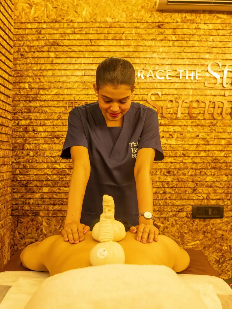 Aromatherapy massage at The Bali Spa & Wellness with therapist using essential oils for full body relaxation and stress relief